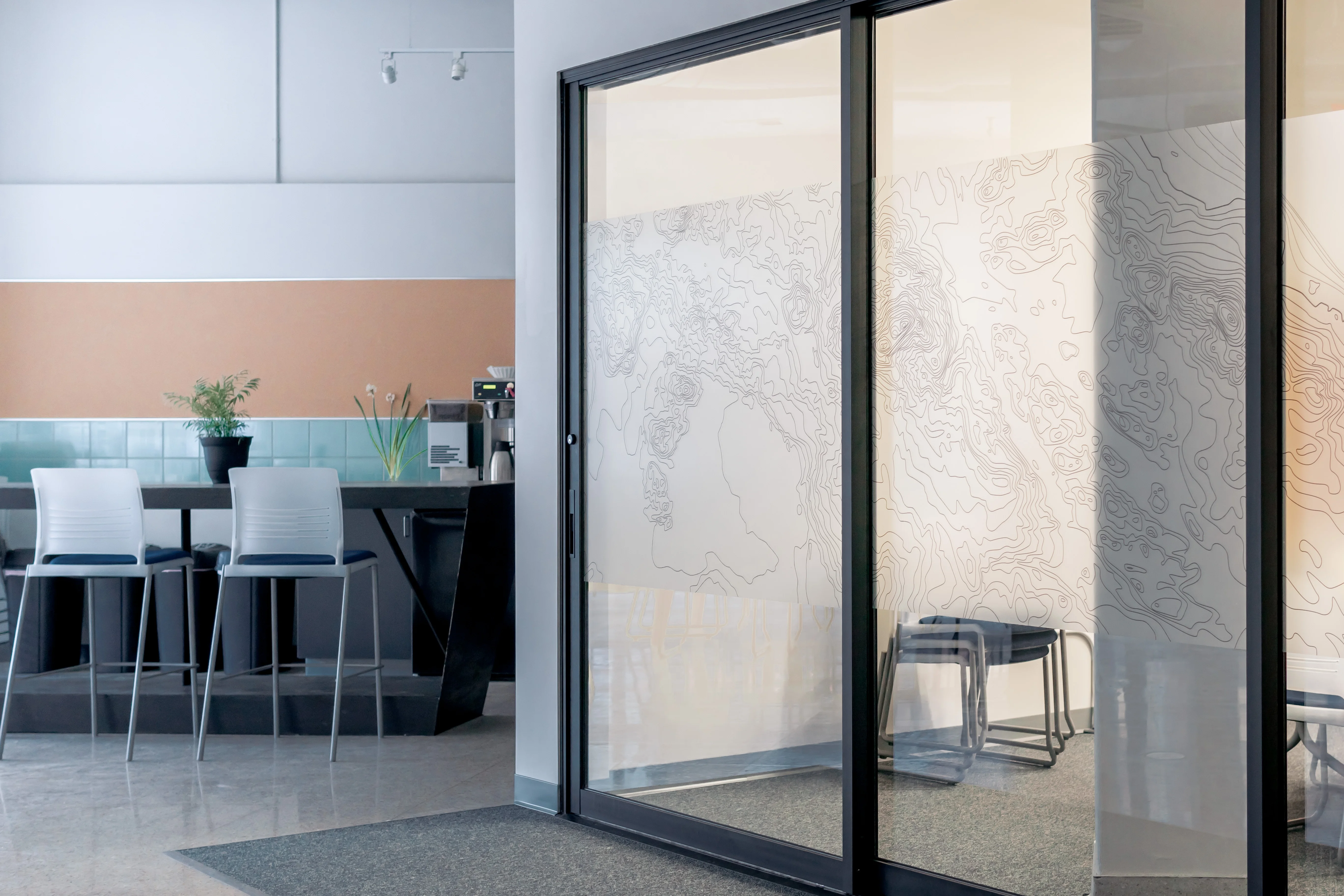 Completed architectural glass partition in a modern workspace